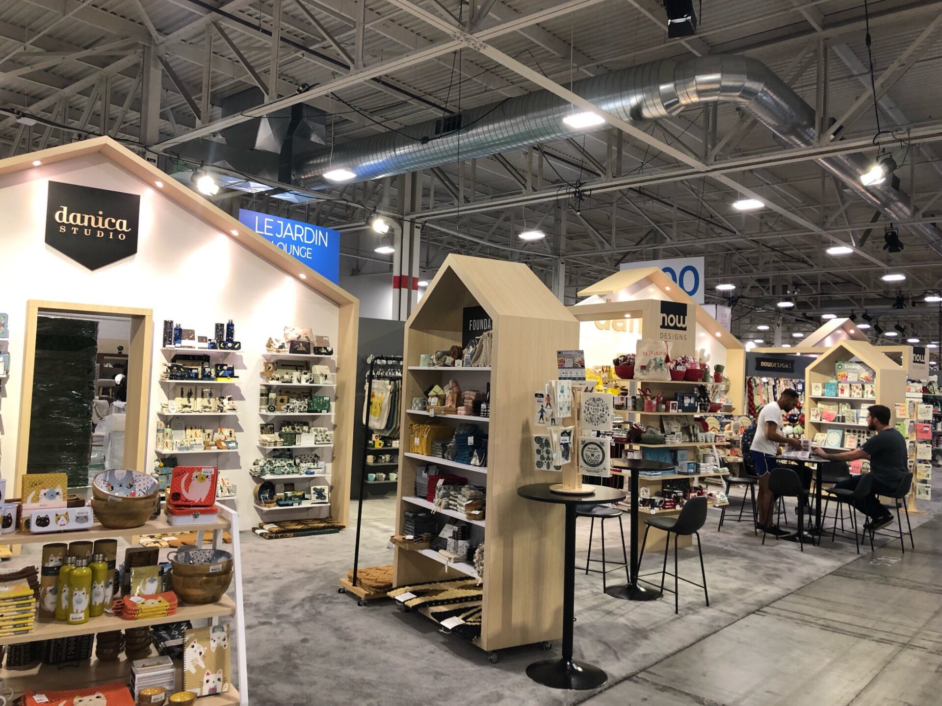 Danica trade show booth with wood and home decor/gifts