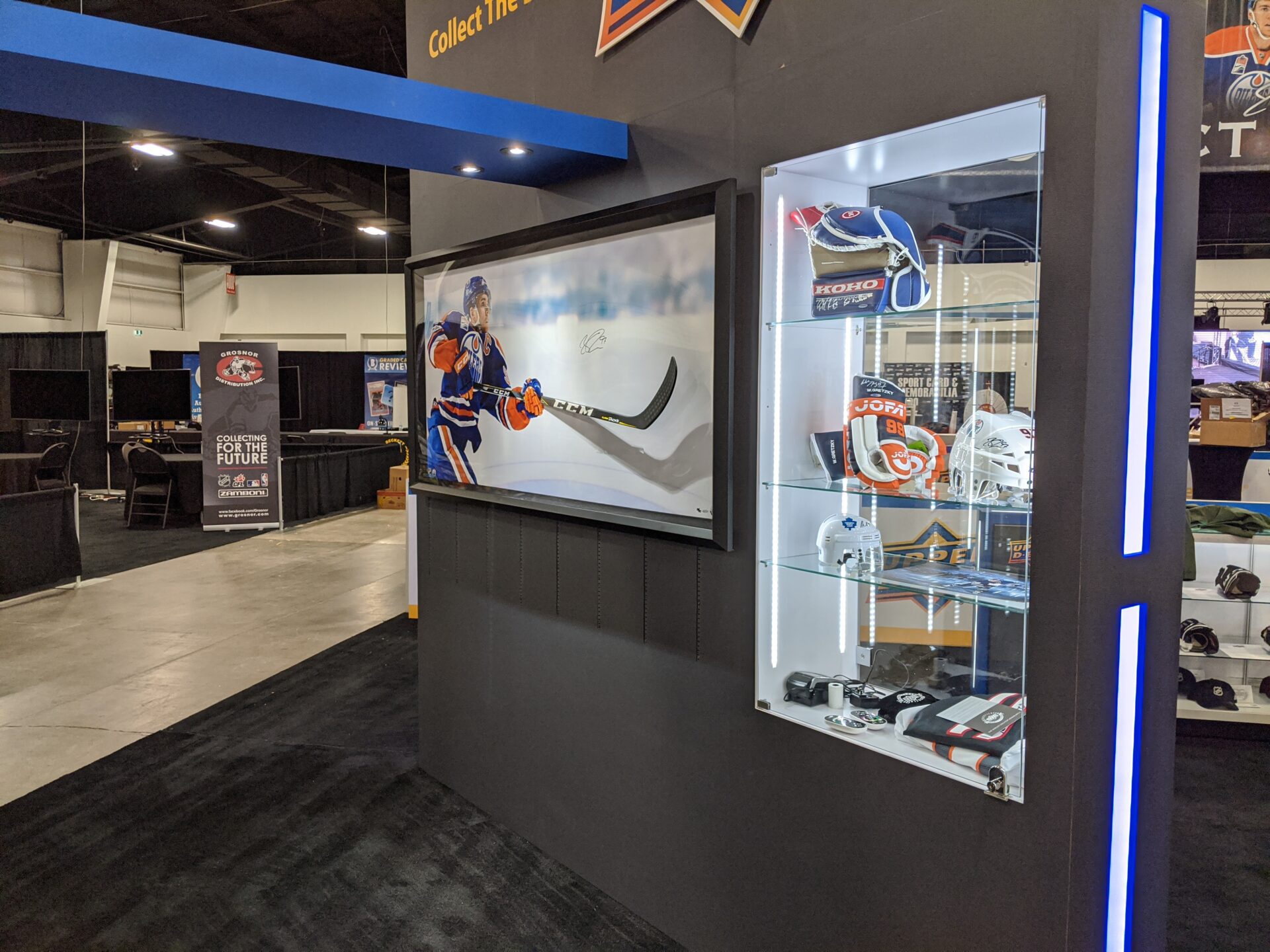 Upper Deck trade show booth with glass exhibits and memorabilia