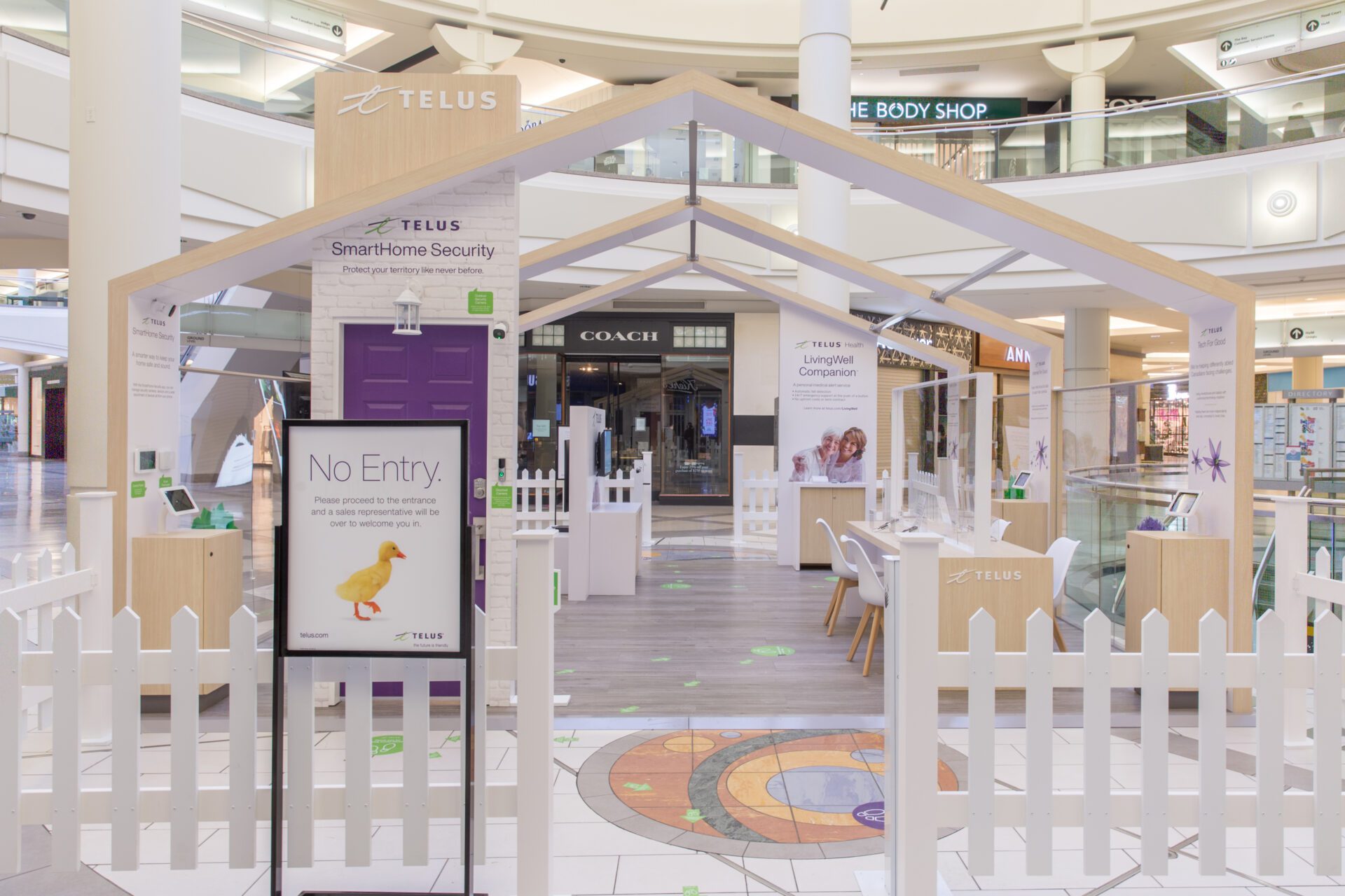 Telus wooden permanent mall display from front