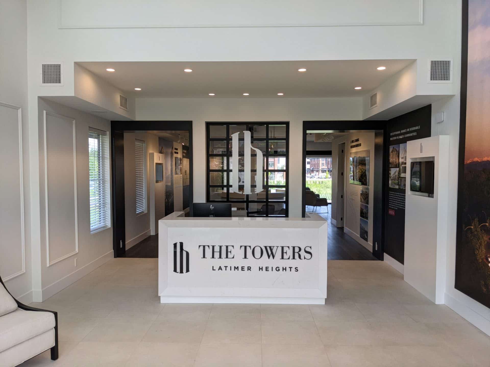 Latimer Heights towers sales center and showroom with white counter