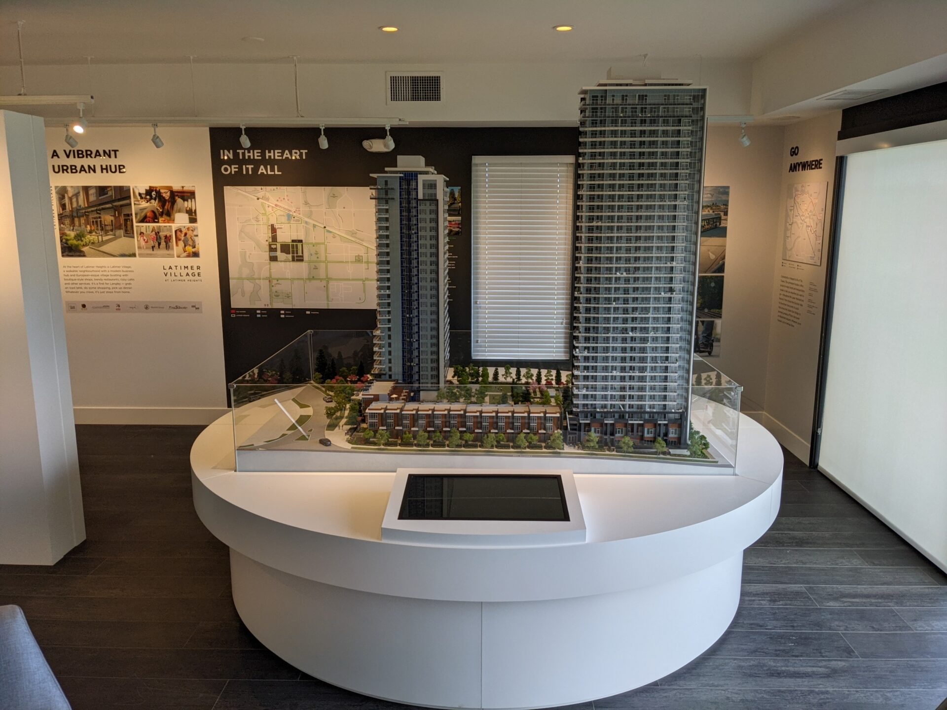 Latimer Heights towers sales center and showroom with miniature building representation