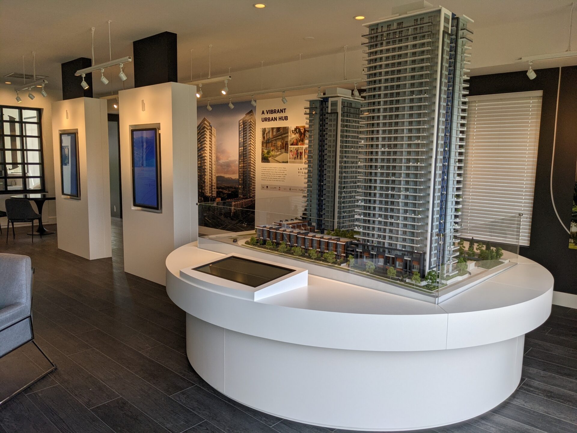 Latimer Heights towers sales center and showroom with miniature building representation