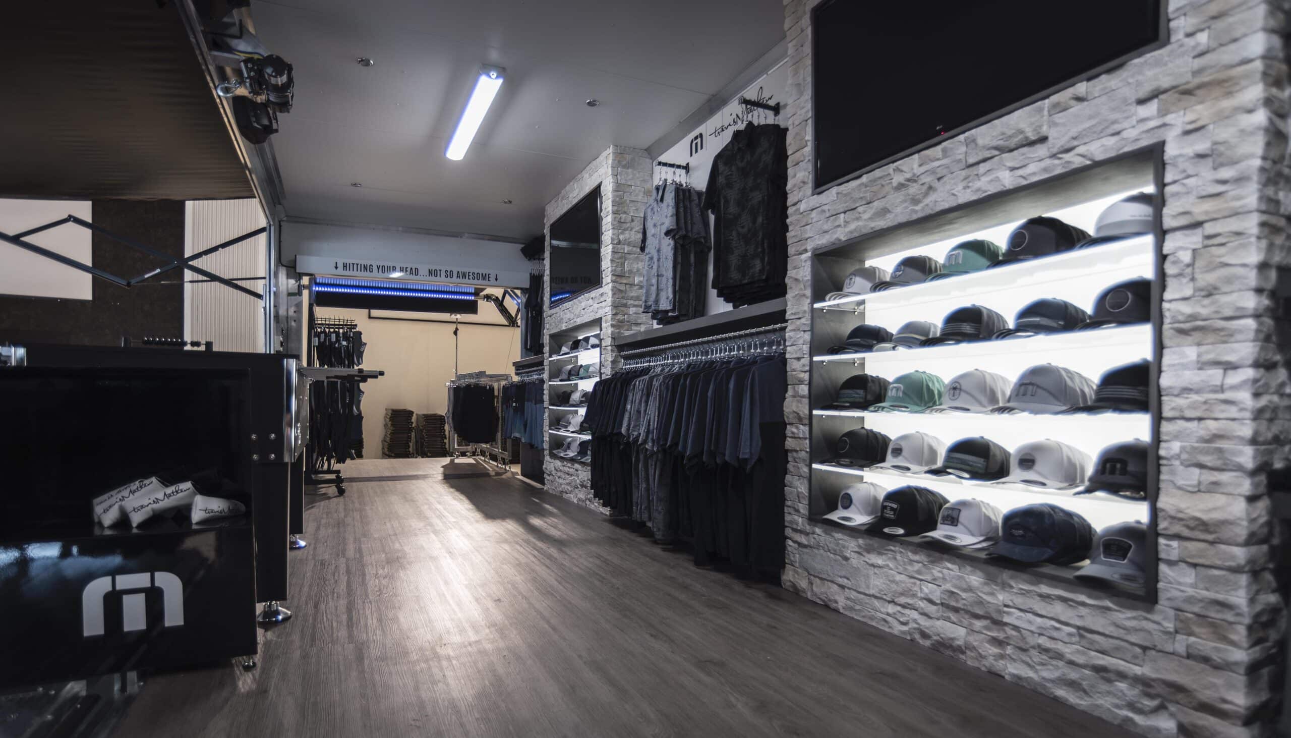 Travis Mathew mobile showroom with hats, shirts and other merchandise