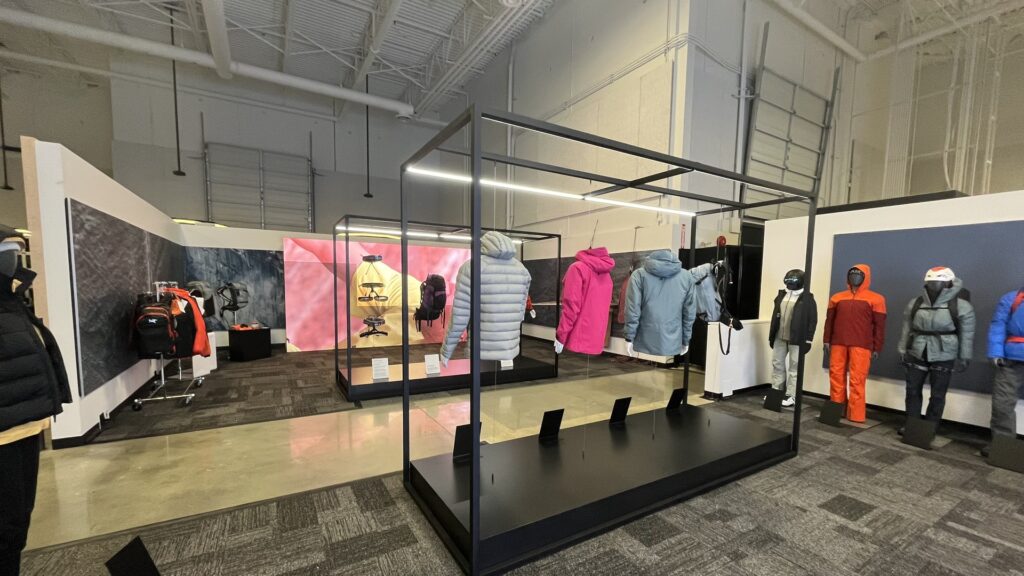 Arc'teryx branded retail environment with custom exhibit case and product displays showing trade show ROI in a secondary market activation