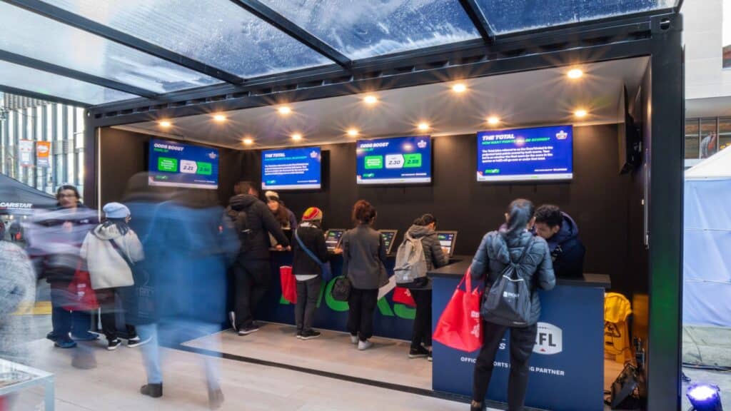 BCLC betting kiosk activation at the Grey Cup showing live interactive data-capture used for measuring mobile tour ROI