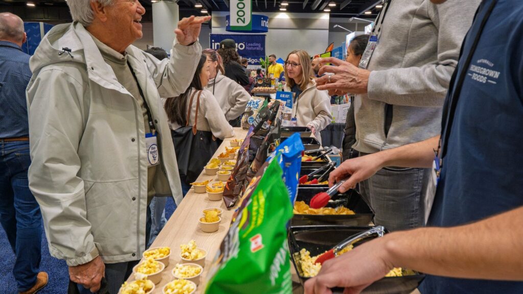 Magic Scoop trade show booth engagement with sampling crowd